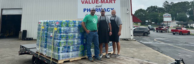 Rome, Ga. IP employees load water on a flatbed trailer