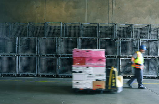 man pulling a pallet jack