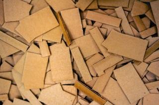 Layered flat corrugated material 