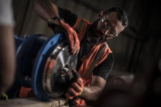 A man works safely with a power tool
