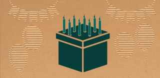 cardboard box with candles on top, simulating a birthday cake
