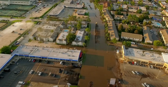 An aerial view of a flooded town 