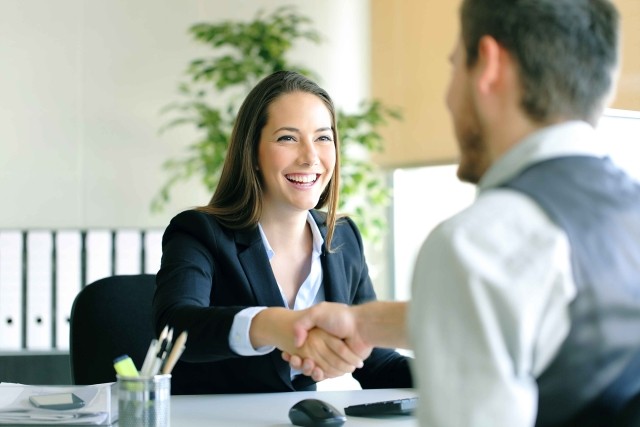 A Human Resources representative welcomes a new employee