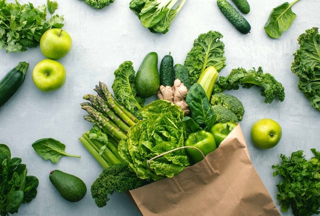 Fresh groceries in a kraft paper bag