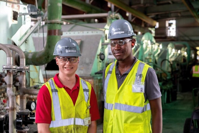 Early career employees smiling