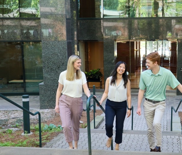 Employees walking and smiling