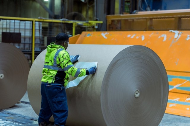 Worker with paper roll