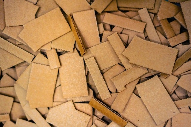 Layered flat corrugated material 