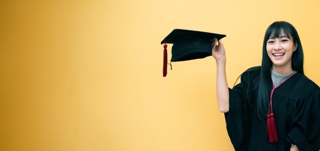 A college graduate tips her cap