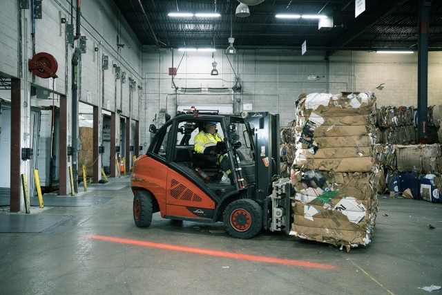 forklift moving a stack of bales