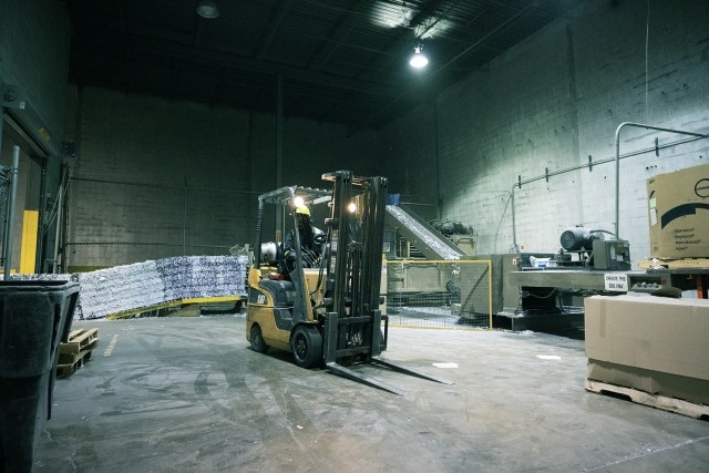 forklift in the middle of a warehouse