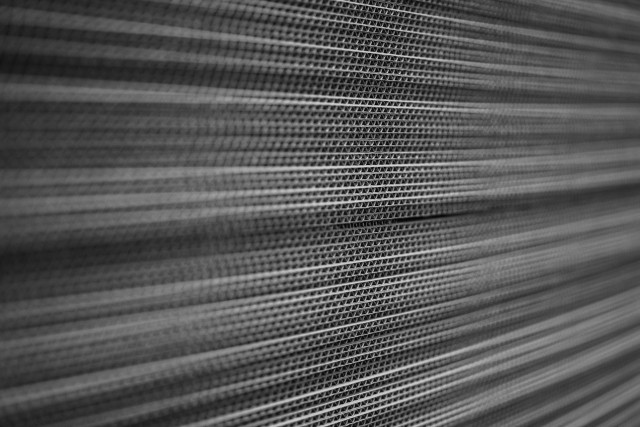 a close-up of stacked corrugated sheets