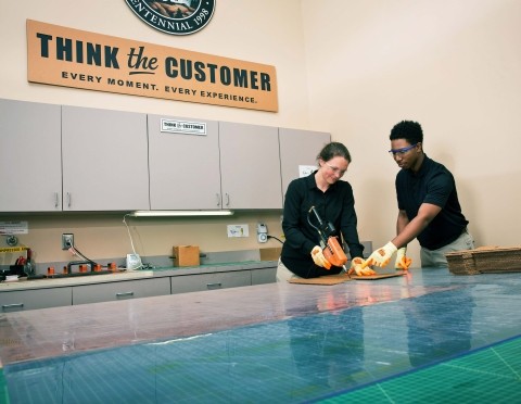 Two packaging designers in a packaging lab